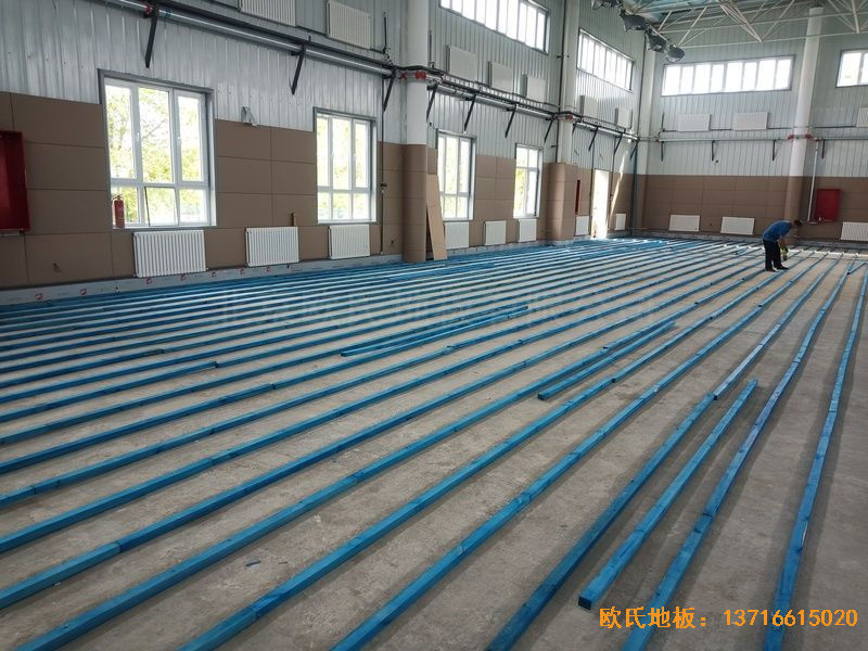 新疆克拉瑪依市獨山子虹園小區(qū)體育館體育木地板施工案例