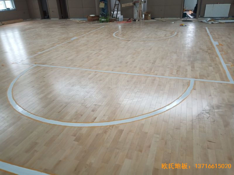 新疆克拉瑪依市獨山子虹園小區(qū)體育館體育木地板施工案例